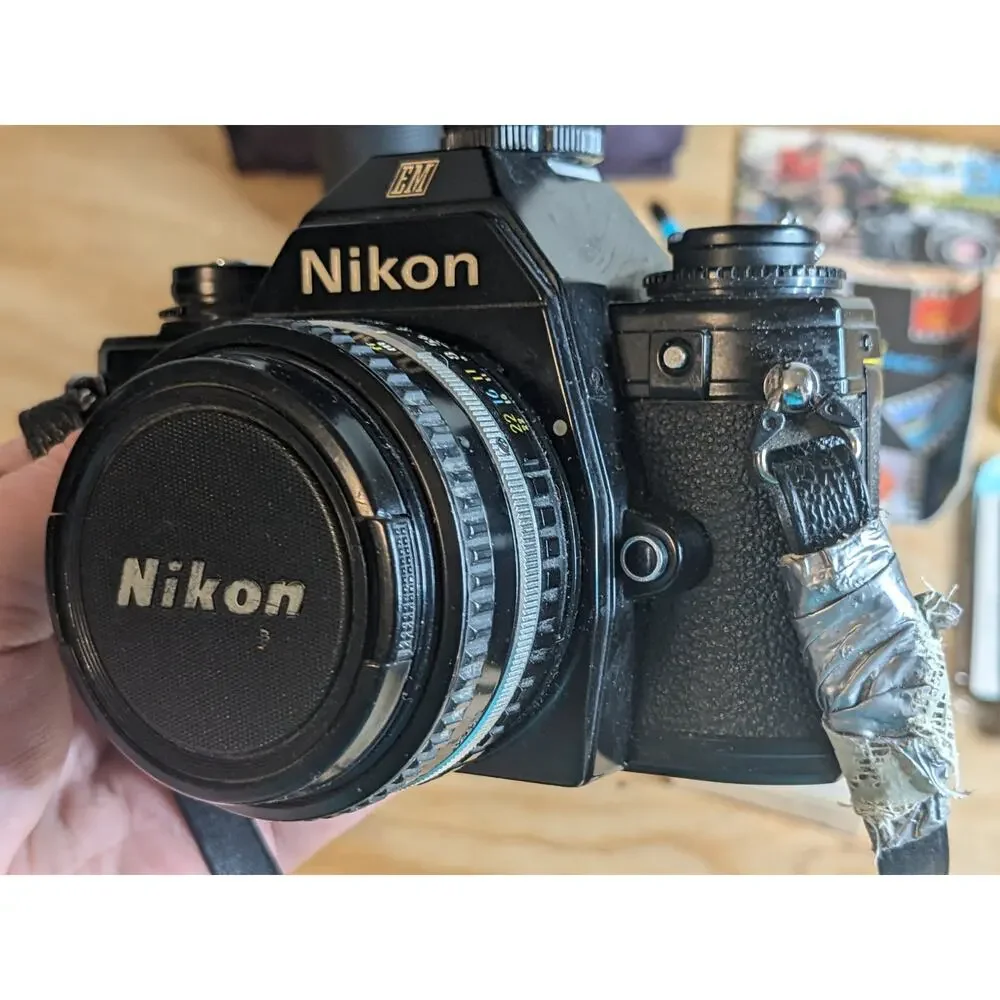 Nikon EM Black body 50mm Series E + Auto Tele Converter + Bag + Kalimar Light +